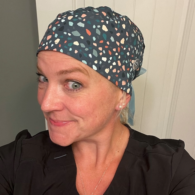 Healthcare professional wearing Calomed scrub cap